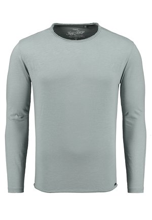 Camiseta de manga larga de color gris claro, hecha de material suave. Cuenta con un cuello redondeado con un ligero estiramiento y un dobladillo recto.