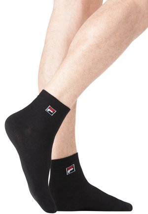 Chaussettes de cheville noires en mélange de coton, avec un petit logo rouge, blanc et bleu. Texture lisse et ajustement serré autour des chevilles.