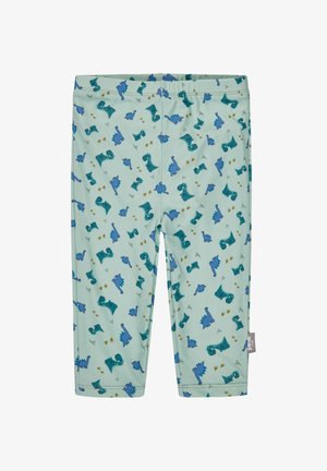 Hellgrüne Babyhosen mit blauen und türkisen Dinosauriermustern und braunen Fußabdrücken, ausgestattet mit einem elastischen Bund und einem kleinen Stoffetikett an der Seite.