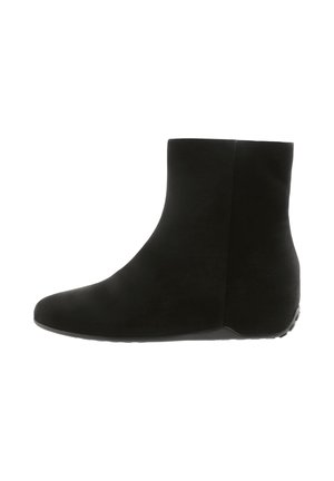 Black ankle boot with a smooth suede texture, rounded toe, and a subtle wedge heel. Features a simple, seamless design and rubber outsole.