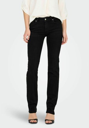 Jeans de mezclilla negra con un corte ajustado y diseño clásico de cinco bolsillos. La tela tiene una textura suave y detalles de costura mínimos.