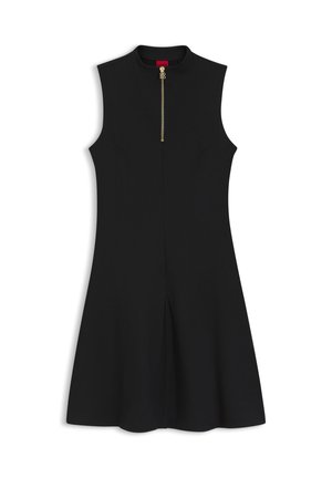 Αμάνικο μαύρο φόρεμα σε γραμμή Α με ψηλό λαιμό και χρυστό φερμουάρ μπροστά, εφαρμοστό στο πάνω μέρος και φαρδύ κάτω από τη μέση.