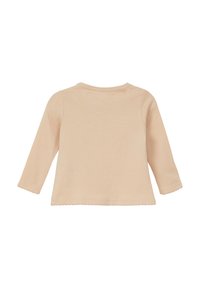 Długi rękaw, jasnoróżowa bluzka wykonana z miękkiej bawełny. Posiada okrągły dekolt i falbaniaste wykończenia rękawów. Minimalistyczny design, brak wzorów lub akcentów.