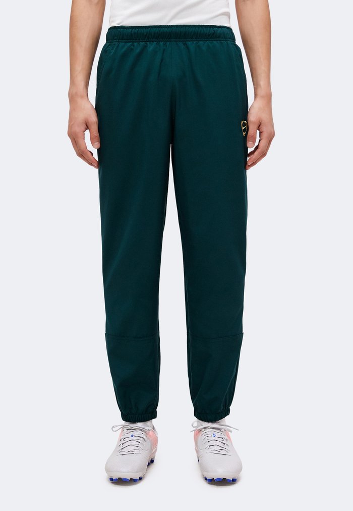 Nike Tracksuit bottoms - midnight spruce/sail/metallic gold-coloured