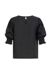 Blouse noire avec manches trois-quarts bouffantes, poignets froncés élastiqués et fermeture à bouton en forme de goutte à l'arrière du col.