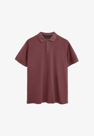 Kortærmet polo i mørkerød med knaplukket krave og lille broderet logo på venstre bryst.
