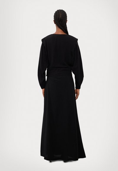 Long black dress with a fitted bodice and flowing skirt. Features puffed sleeves and a wide neckline. Made from a soft, smooth fabric.