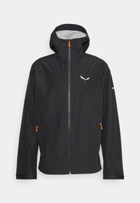 Veste noire imperméable avec une capuche ajustée, une fermeture éclair à l'avant, des accents orange et un logo. Comprend deux poches latérales zippées. Matériau léger.