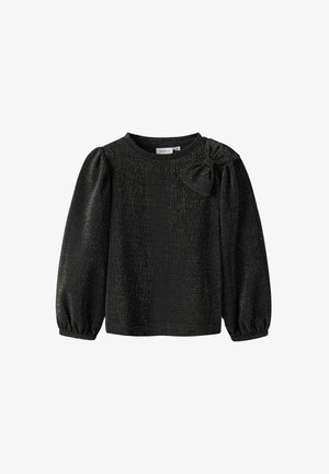Top noir à manches longues avec un col rond et des manches bouffantes, présentant un tissu texturé avec des éclats dorés métalliques et un accent en forme de nœud sur l'épaule.