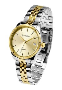 Reloj de acero inoxidable en tonos plata y dorado con un dial redondo dorado, superficie texturizada y ventana de fecha, presentado en una correa de eslabones.