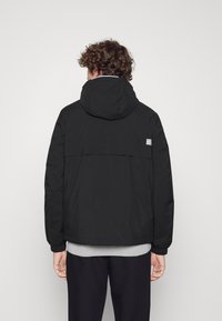 Tommy Hilfiger Übergangsjacke - black