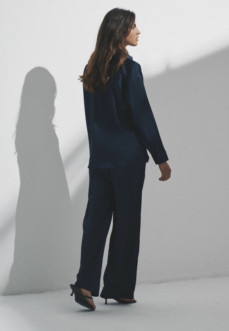 Completo da donna in cotone e lino, 2 pezzi, casual, estivo, abbinato, per ufficio, lavoro, senza maniche, con bottoni, scollo a V, gilet e pantaloni a gamba larga, Arancione, S