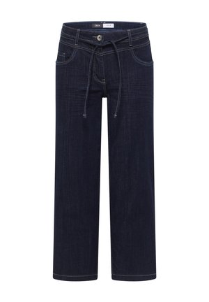 Jean ample bleu foncé avec bouton sur le devant, taille avec cordon de serrage, deux poches avant et détails de surpiqûres visibles.