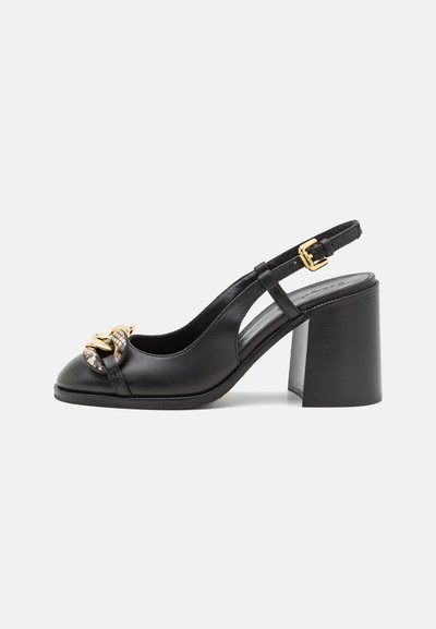 Black leather slingback high heel featuring a rounded toe, wide block heel, and a decorative gold accent at the front. Smooth texture.