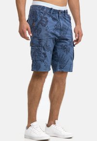 Blue cargo shorts with a floral pattern, featuring side pockets and a button closure. Made of lightweight fabric, suitable for casual wear.