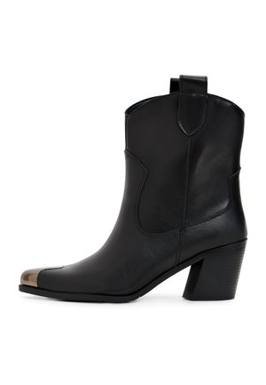 Black leather ankle boots with a rounded toe, featuring a metallic toe cap, angled shaft, and a stacked heel. Smooth texture and minimal design.