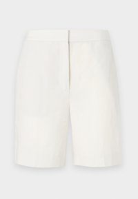 Hvite bomullsbukser med rett snitt, flat front og subtil tekstur. Har en midje og ingen synlige lommer. Enkelt design.