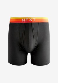 Fekete boxer alsónadrág sima textúrával, narancssárga és sárga színátmenetes elasztikus derékkal, amelyen fehér betűkkel a "NEXT" felirat látható.