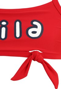 Röd bikiniöverdel med knytskärning, prydd med vit tryckdesign i fet stil. Tillverkad av mjukt, elastiskt tyg med sömlös finish.