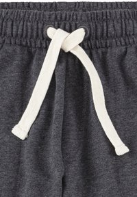 Graue Sweatpants aus strukturiertem Stoff, mit elastischem Bund und einem kontrastierenden cremefarbenen Kordelzug, der zu einem Knoten gebunden ist.