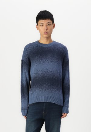 Knitted sweater in gradient blue shades, featuring a crew neck, ribbed cuffs, and textured pattern, made from soft fabric.