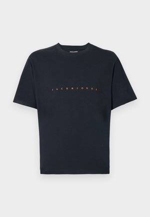 Black cotton t-shirt featuring short sleeves and a crew neck. Front displays "JACK & JONES" in bold orange lettering. Smooth texture.