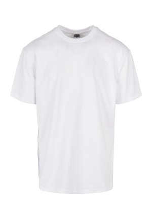 Camiseta de algodón blanca con mangas cortas, escote redondo, corte holgado y dobladillo recto. Sin patrones ni acentos visibles.