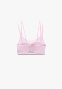 Bralette rosa chiaro con spalline sottili, una texture liscia e un logo minimalista sulla parte anteriore. Design semplice con una finitura in tessuto morbido.