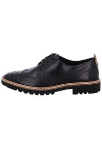 Scarpa da uomo in pelle nera con dettagli brogue, punta rotonda e suola in contrasto marrone chiaro. Presenta cinque occhielli e un tacco texturizzato.