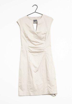 Beige short dress with cap sleeves, featuring a v-neckline and gathered texture. Smooth fabric, below-knee length, and side hem detail.