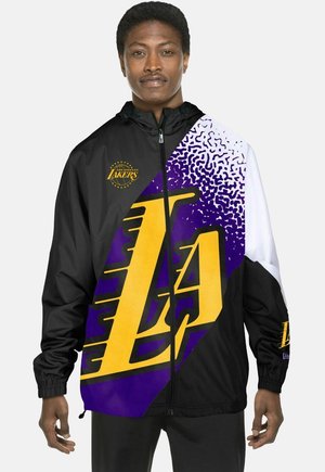 Black and white windbreaker featuring purple and yellow geometric patterns, with "LA" logo prominently displayed on the front.