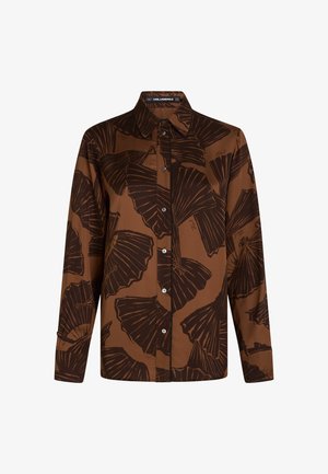 Rudas mygtukų marškiniai su lapų raštu tamsiai rudos spalvos, turintys smailų apykaklę ir ilgomis rankovėmis su mygtukais.