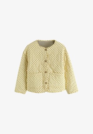 Gelbe Steppjacke mit schwarzen Punkten, rundem Ausschnitt, Knopfleiste, zwei Vorderentaschen und langen Ärmeln.
