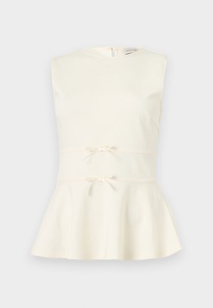 Μπεζ μπεζ τοπ χωρίς μανίκια με στρογγυλή λαιμόκοψη, δύο μικρά διακοσμητικά φιόγκοι στη μέση και φερμουάρ στην πλάτη.