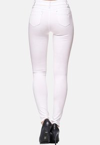 Elara Vaqueros pitillo - weiß