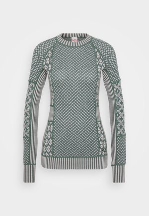 Green patterned sweater with long sleeves, crew neckline; features a mix of geometric designs and stripes in contrasting lighter colors.