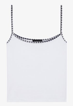 Bela majica brez rokavov iz mehkega materiala, ki ima ozke spaghetti trakove in črno-belo karo obrobo okrog ovratnika.