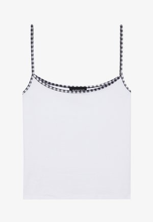 Bela majica brez rokavov iz mehkega materiala, ki ima ozke spaghetti trakove in črno-belo karo obrobo okrog ovratnika.