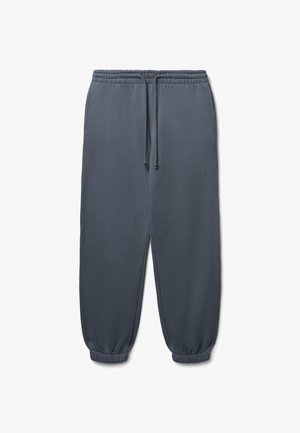 Pantaloni sportivi grigio scuro, a gamba affusolata, con vita elasticizzata, dettaglio con cordino e polsini a costine. Tessuto morbido con tasche laterali.