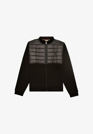 Juoda striukė su užtrauktuku, viršutinė dalis su siūtiniu paminkštinimu, apatinė dalis lygi, su briaunotomis rankogaliais ir šoniniais kišenėmis.