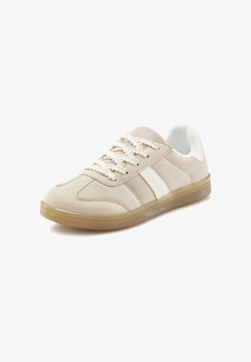 Beige sneaker with a smooth upper, white accent stripes, and textured rubber sole. Features round laces and padded collar for comfort.