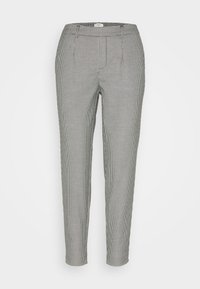 Pantalon à carreaux noir et blanc avec une coupe ajustée, doté d'une taille, de poches latérales et d'une texture lisse.