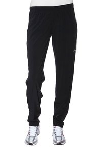 Black athletic pants made of lightweight fabric with an elastic waistband. Features a slim fit and a small white Nike logo on the left thigh.