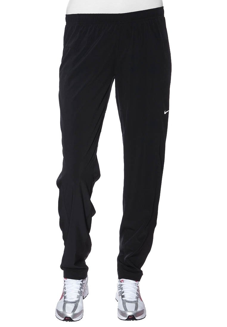 Black athletic pants made of lightweight fabric with an elastic waistband. Features a slim fit and a small white Nike logo on the left thigh.