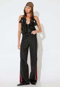 Koton X İNJI - WIDE LEG - Trainingsbroek - black