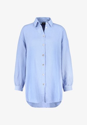 Light blue, button-up shirt made of textured fabric. Features a collar, long sleeves with elastic cuffs, and a rounded hem.
