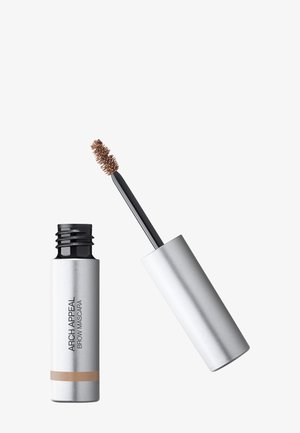 Silver tube of Arch Appeal brow mascara with brown tinted brush applicator extended beside it on white background.