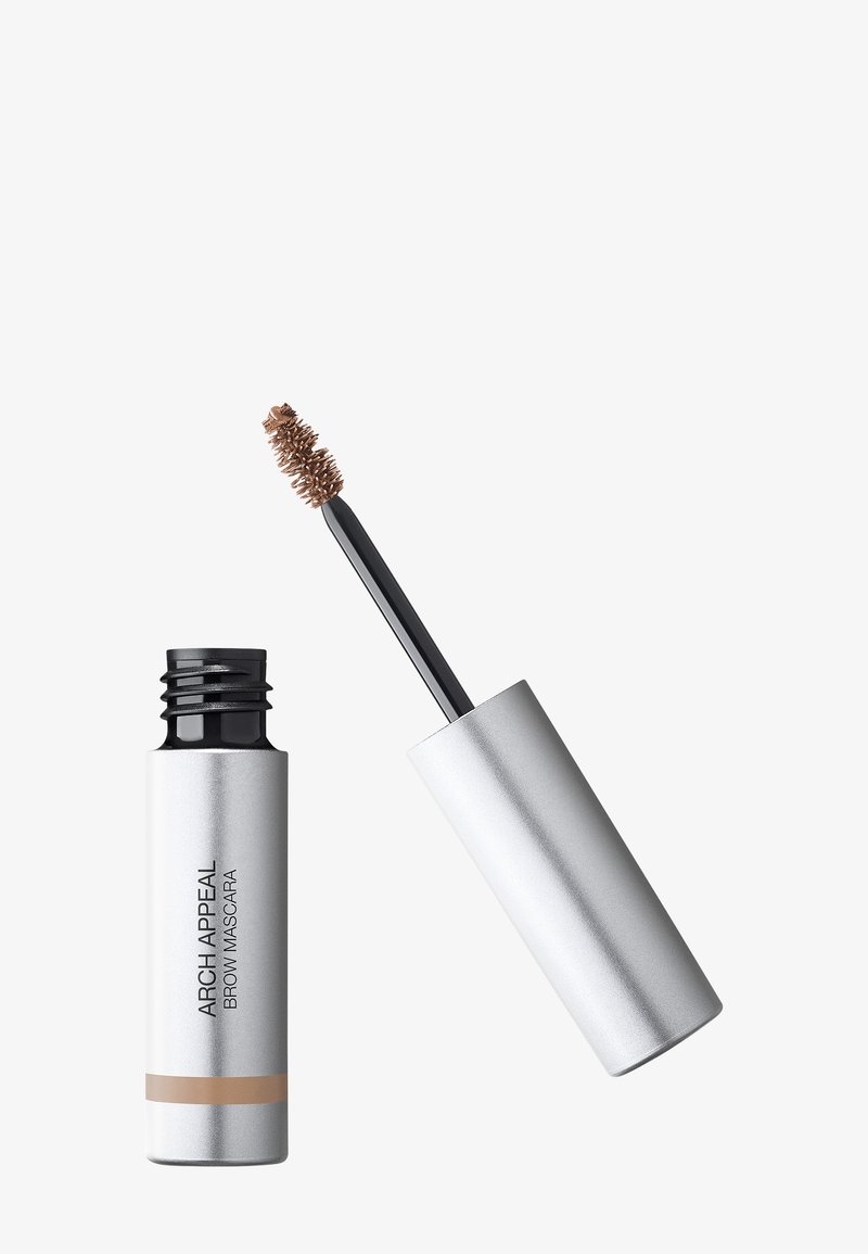 Tube argenté de mascara à sourcils Arch Appeal avec applicateur brosse teinté brun étendu à côté sur fond blanc.