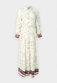 Garas pogājamas krēmkrāsas kleita ar zelta ķēdes rakstu. Raksturīgas garas piedurknes, josta viduklī un krāsainas svītras aprocēs.