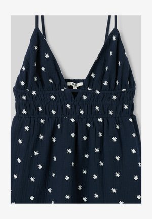 Robe sans manches bleu marine avec motifs d'étoiles blanches brodées, décolleté en V, et détail de taille smockée élastique.